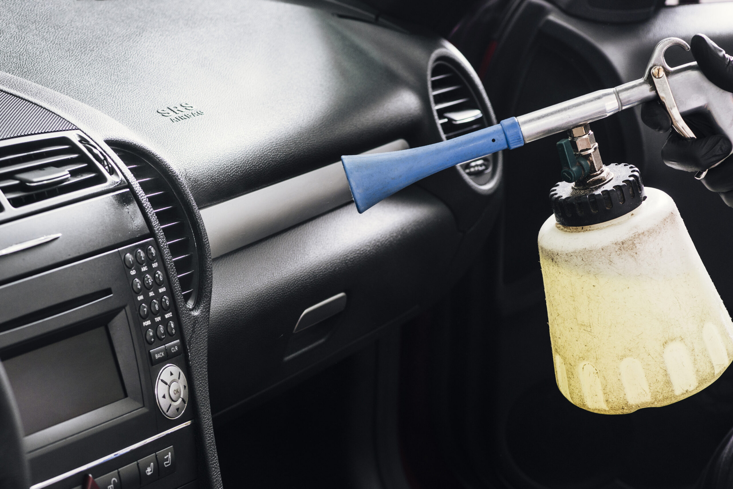 close-up-person-cleaning-car-interior